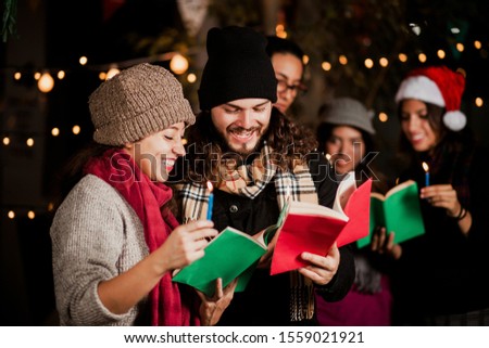 Mexican Posada, friends Singing carols in Christmas in Mexico