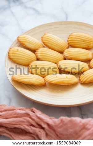 Plate of Madeleines on Marble Background