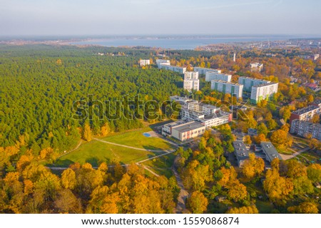 Aerial view photo from flying drone of Vecmilgravis district in beautiful autumn sunset in Riga, Latvia