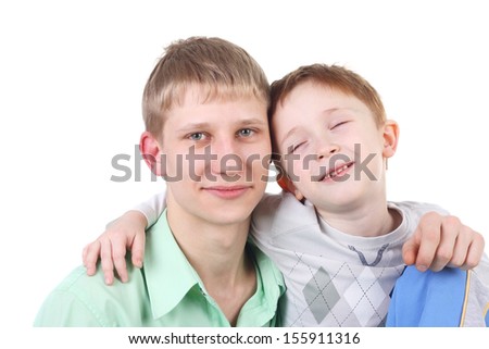 two adult and kid brothers laughing