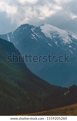 Mountain range under clouds. Rocks for Hiking and tourism