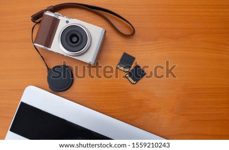 The Set of Digital Compact Camera and SD Card and Laptop for Travel 
