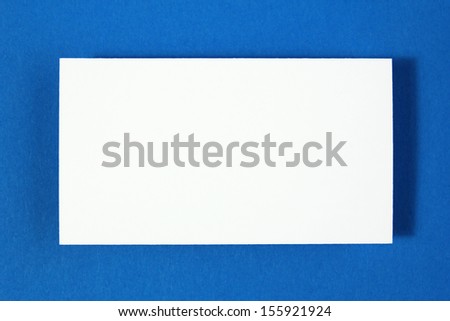 blank business card on blue paper background