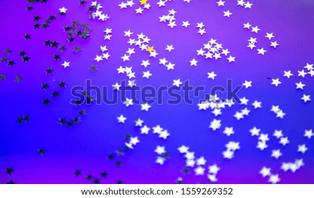 multi-colored lights garlands, festive background, shiny stars