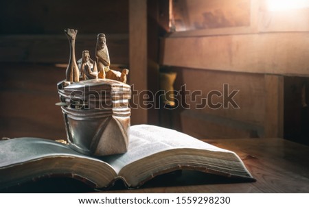 Adventure of Noah's Ark with animals, story in Bible, Wood carving doll, christian concept. Royalty-Free Stock Photo #1559298230