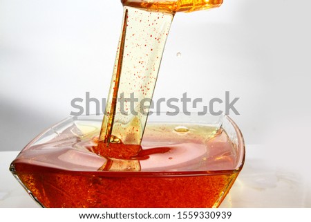 Mixture of oil and red color liquid