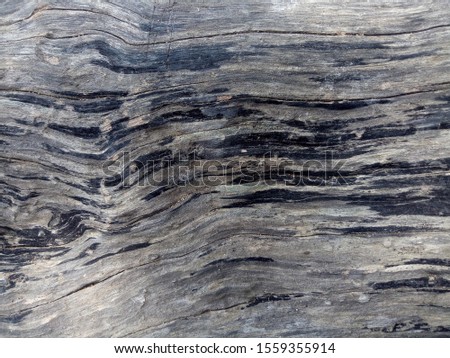 wood grain in the direction of dark color