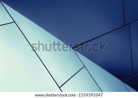 Tilt close-up photo of office building fragment, Abstract background in blue colors on the subject of modern architecture