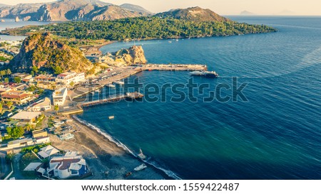 Aerial view photo from flying drone of Panoramic view from the volcano of Vulcano Island in a summer day. The islands of Lipari and Salina are visible in the distance, Aeolian Islands, Sicily, Italy. 