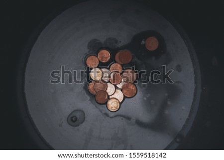 Thai coins in monk alms bowl, Merit in Thai buddhist tradition