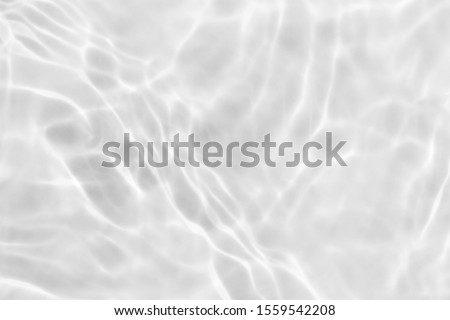clear white wave abstract or natural rippled water texture background Royalty-Free Stock Photo #1559542208