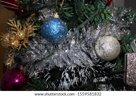 
Christmas balls and decorations on the background of the Christmas tree