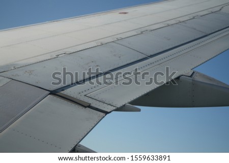 Picture of airplane wing in the sky