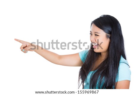 Closeup side view profile portrait of attractive woman pointing and laughing at someone or something, isolated on white background