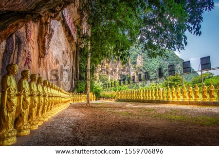 Golden Buddhas statue lining up at Gopeng Road Ipoh