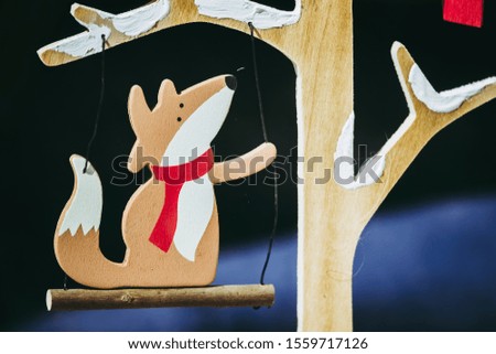 Wooden Christmas decoration depicting a fox