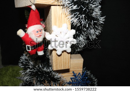 
Christmas decorations, Santa Claus, cones, balls on wood 