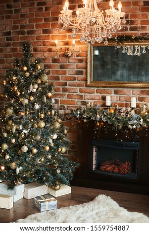 Christmas interior with festive lights, Christmas tree with presents boxes and decorated fireplace. New year interior decorated for winter holidays