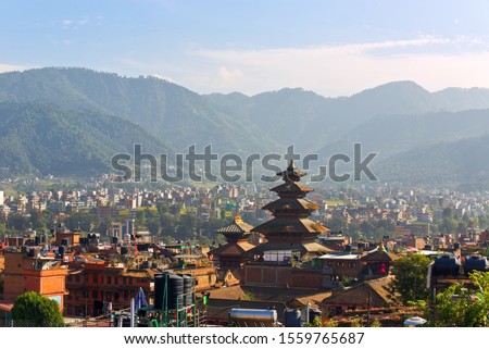 Distant view of Nyatapola Temple in Taumadhi Square, the tallest temple standing tall in an ancient city of Bhaktapur, a UNESCO World Heritage site located in the Kathmandu Valley, Nepal. Royalty-Free Stock Photo #1559765687