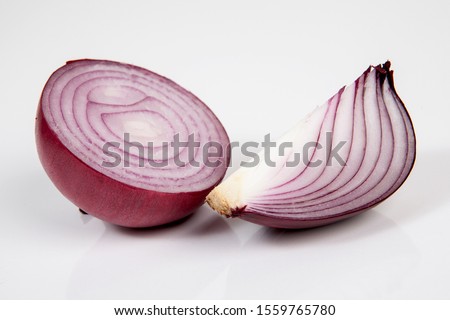 Onion on the white wooden table.