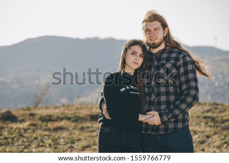 Happy young couple in love. Close up portrait of attractive young couple outdoors. Attractive young couple in love