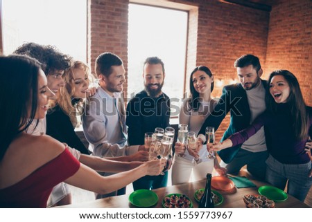 Portrait of nice attractive lovely elegant smart cheerful cheery glad guys people celebrating birthday clinking glass congrats at modern industrial loft brick wood style interior lights indoors