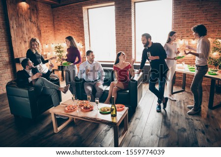 Photo of positive festive birthday party people friendship chatting clinking glasses drink golden wine eating snacks wear formalwear sitting sofa loft room indoors