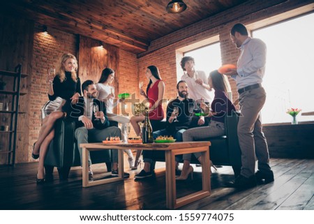Low angle view photo of buddies group birthday party friendship chatting clinking glasses drink golden wine eating snacks wear formalwear restaurant indoors