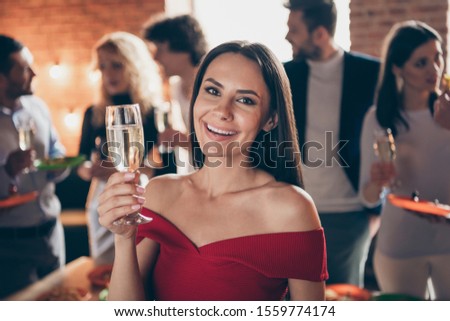 Close-up portrait of nice attractive charming lovely smart cheerful cheery woman celebrating enjoying festive tradition together with best friends at modern industrial brick loft style interior house