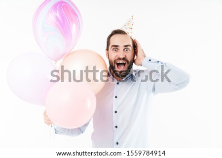 Image of optimistic party man screaming and holding air balloons isolated over white background
