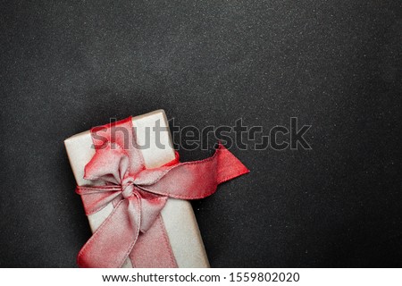 gift box on a black background, blank for postcard, poster, banner, place for your text