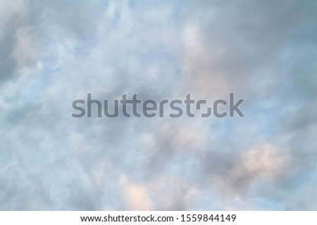Sky with clouds. Evening sky with rain clouds at sunset. Creative natural background.