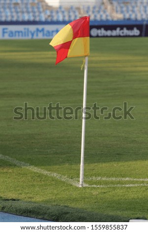 red and yellow soccer corner flag at stadium