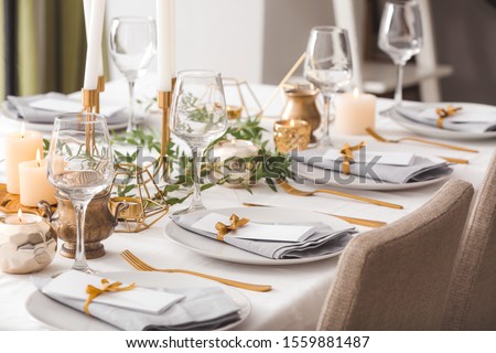 Beautiful table setting with floral decor Royalty-Free Stock Photo #1559881487