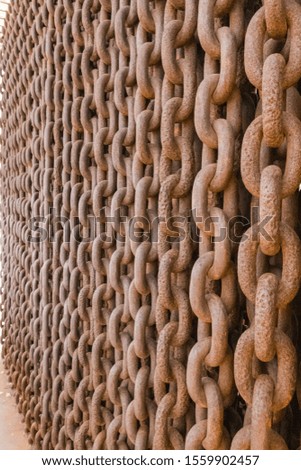 Chain heap wall. Abstract metallic brown chains background