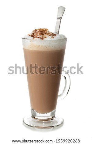 Latte coffee with spoon and froth in a tall glass on white background
