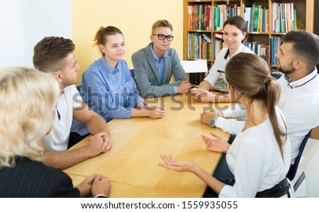 Students with female teacher studying in classroom Royalty-Free Stock Photo #1559935055