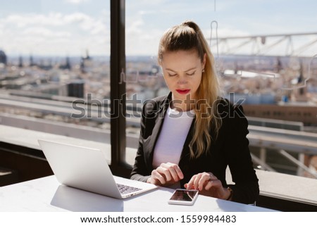 Modern woman. Business woman. Beautiful woman working at laptop.