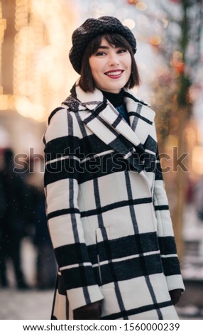 Picture of young brunette on walk on street