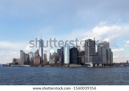 New York City Manhattan downtown skyline with skyscrapers illuminated over Hudson River panorama. USA Trade Center.