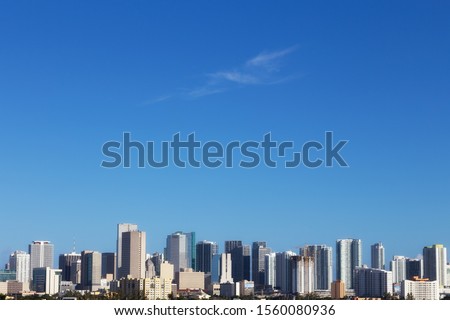 View of Miami skyscrapers with blue sky. Business and residential buildings. Florida, USA