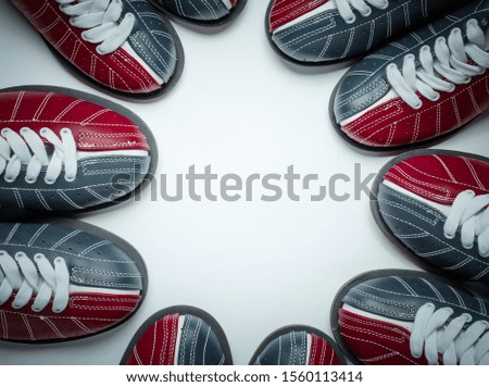 Many bowling shoes on a white background. Entertainment for groups of friends. Copy space. Top view