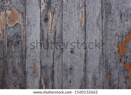 Dark gray wooden cracked background
