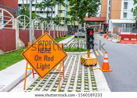 Stop here on red traffic light sign board
