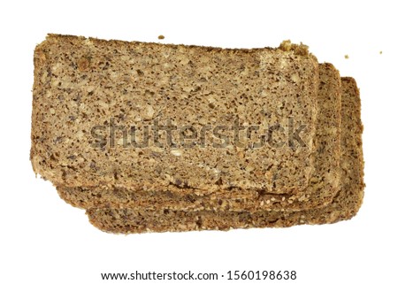 Slices of wholemeal dark bread isolated on a white background in close-up (high details)