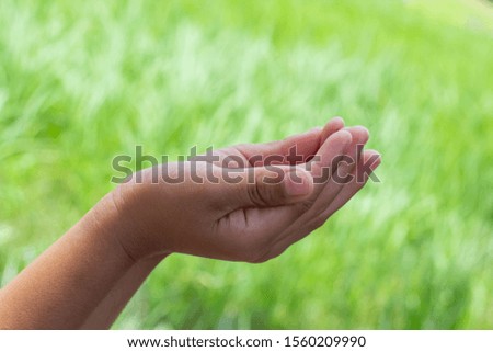 Empty man hand holding isolated on nature background