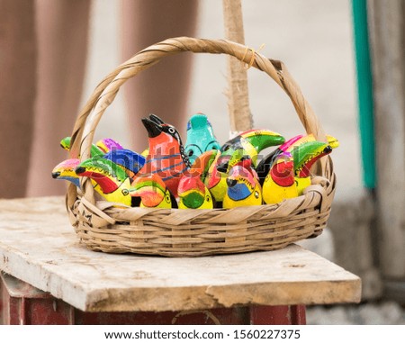Toucan shaped souvenirs in a basket 