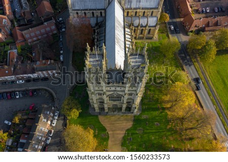 Overhead aerial top down view of Beverley Minster, the large gothic church in the centre of the small market town in East Yorkshire, UK. Shot in Autumn 2019
