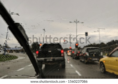 Concept of driving in rain, bad driving conditions.