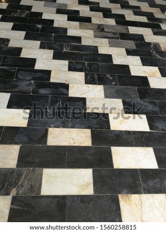 Black grey and beige color marble tile floor 